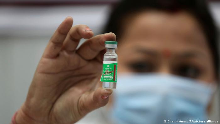 Indian doctor shows an ampoule with Astrazeneca vaccine